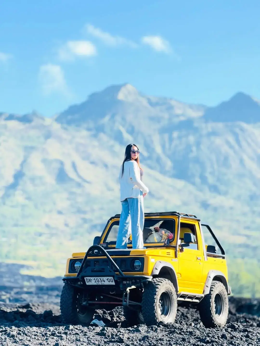 4WD Jeep climbing Mount Batur volcanic roads at dawn